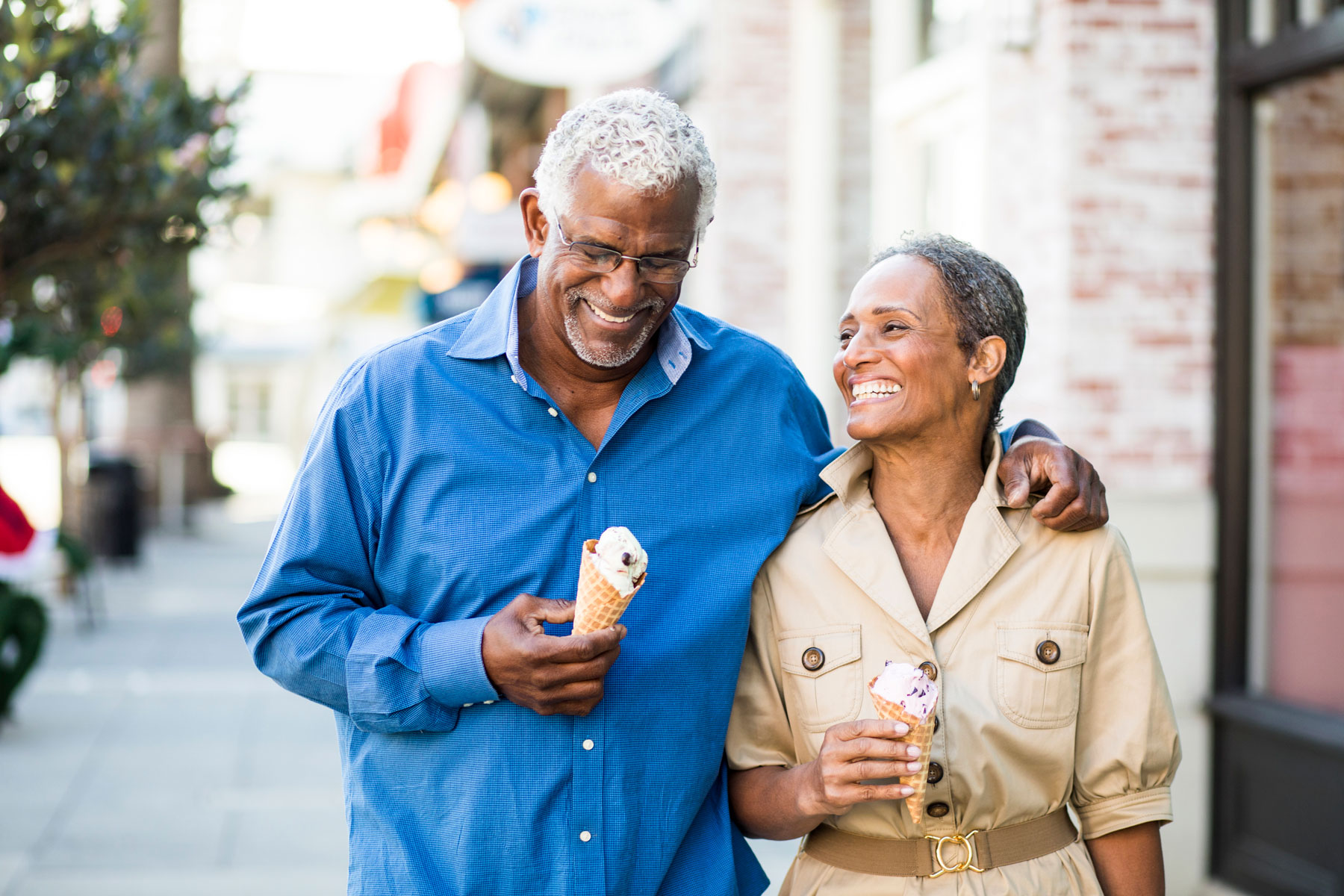 seniors walking through town, eating ice cream, happy