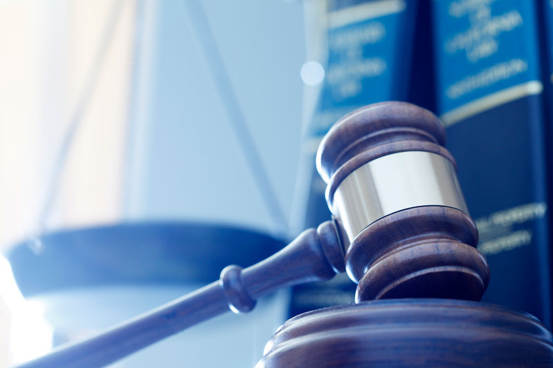 law books with gavel and scales of justice