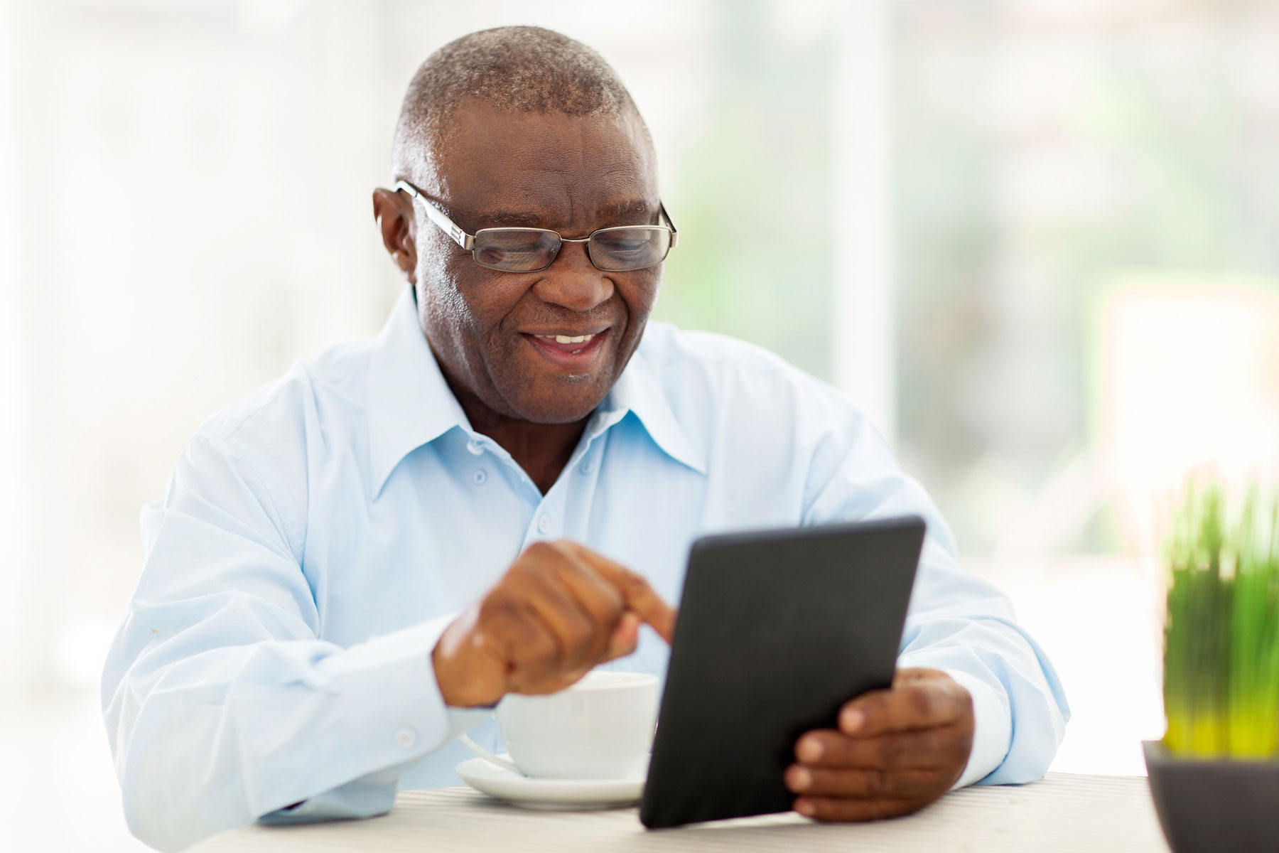 man searching for unclaimed property on tablet device